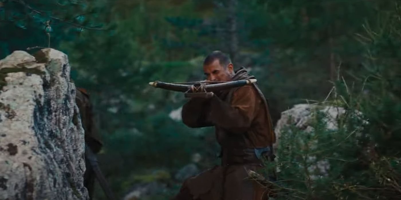 Claes Bang como William Tell Shooting Crossbow