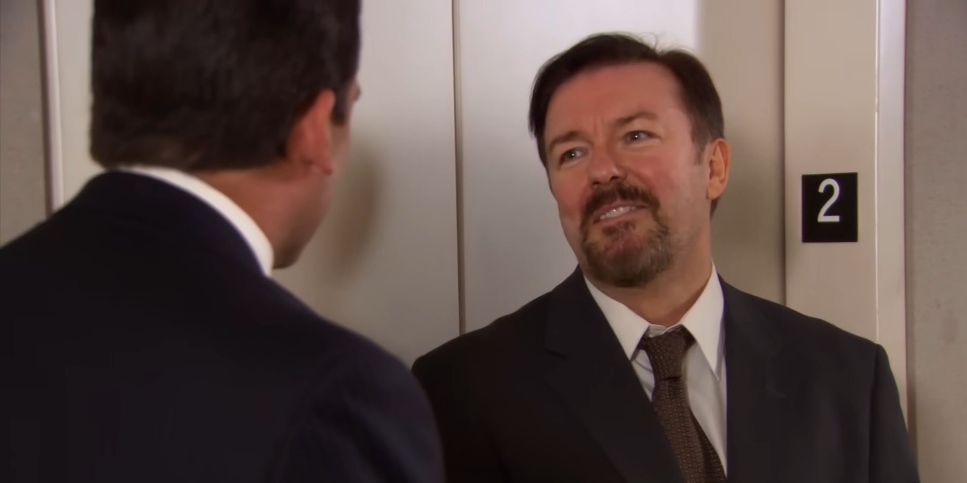 David Brent having a laugh with Michael Scott when they realize how similar they are to one another in The Office-1