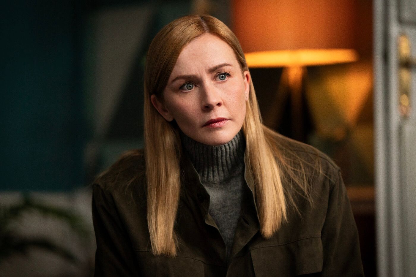 Megan "Smitty" Garretson, played by Eva-Jane Willis, wearing brown turtleneck in FBI: International