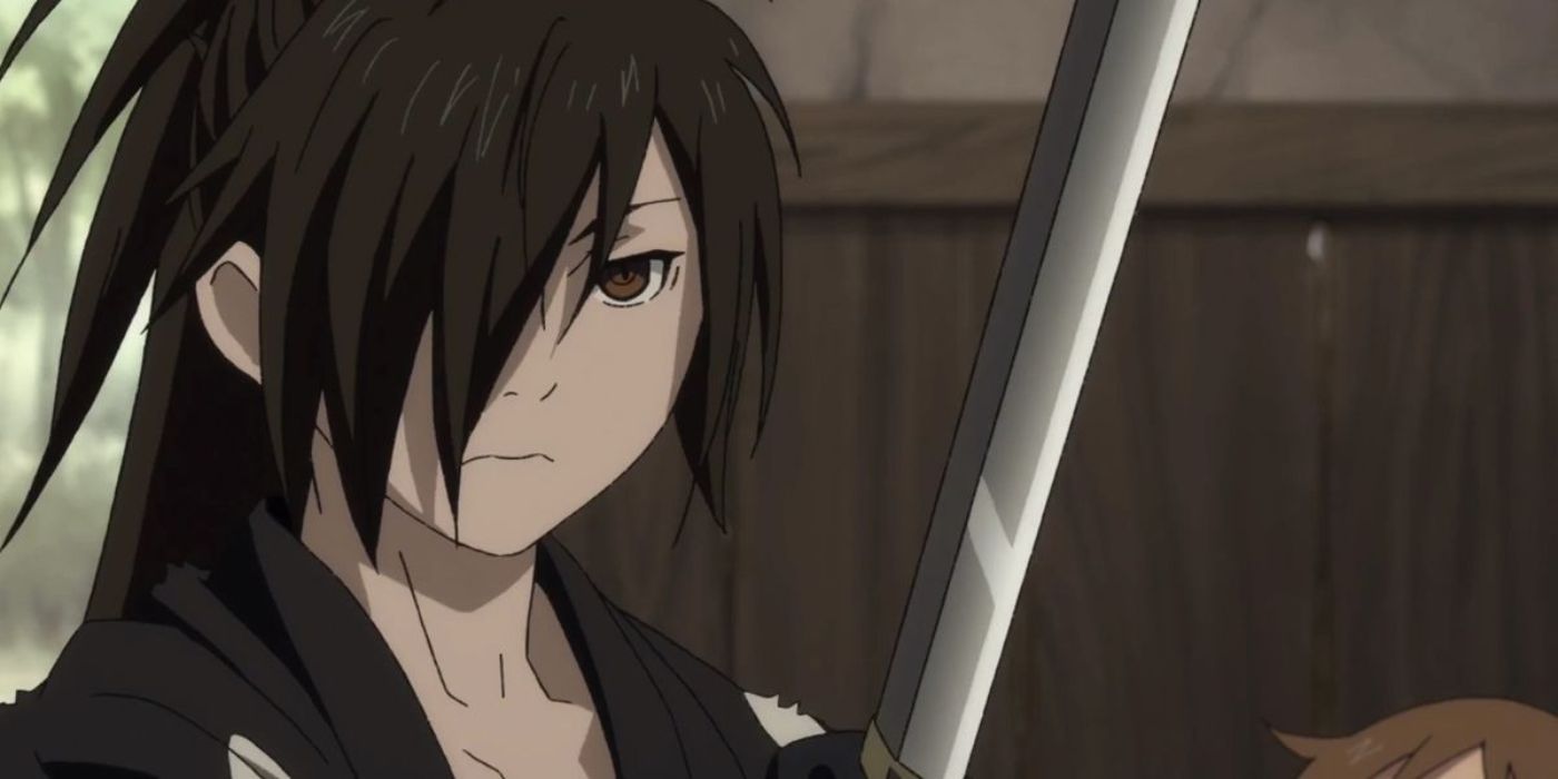 Hyakkimaru has his sword drawn and looks serious in Dororo.