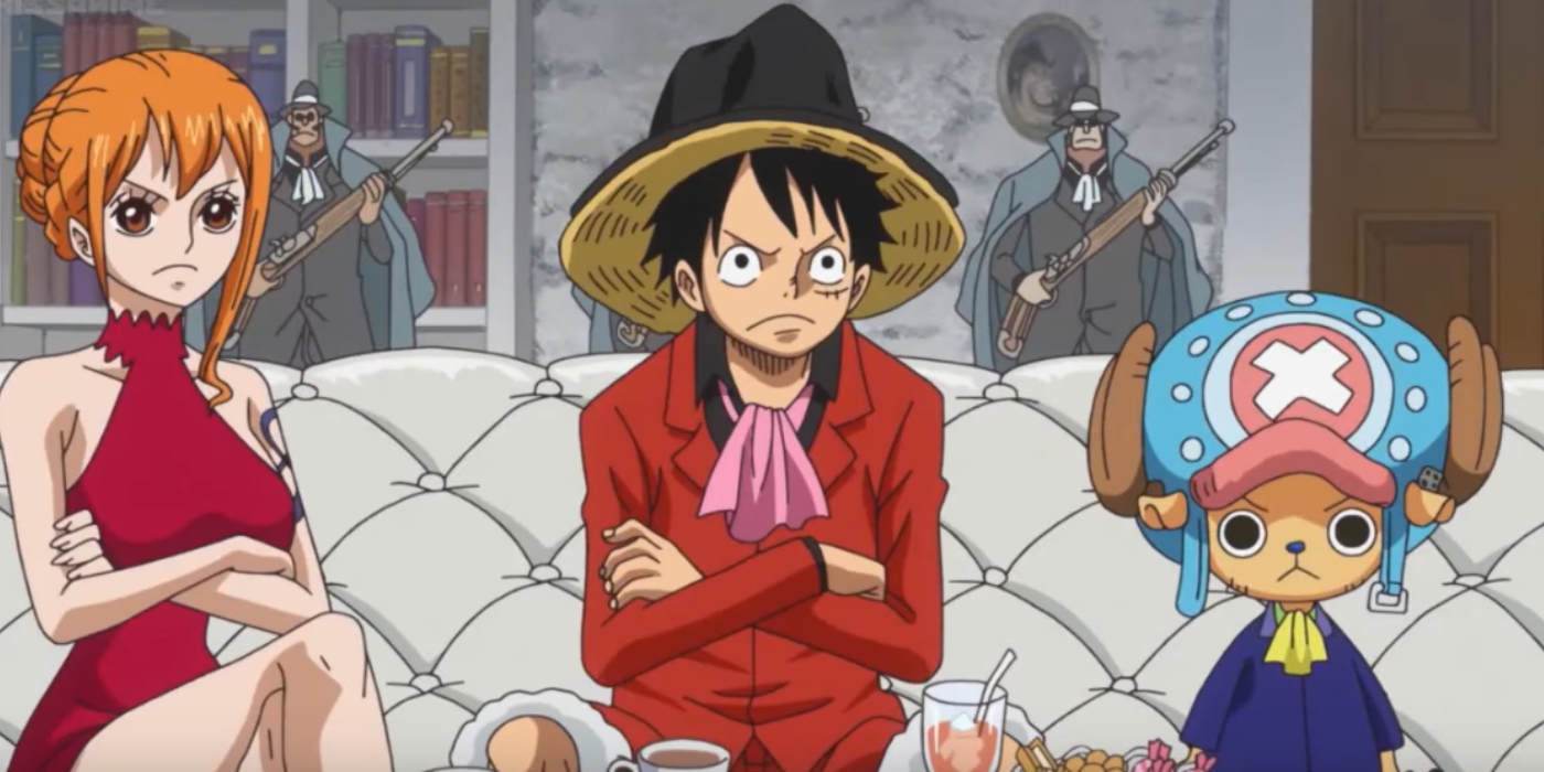 Monkey D. Luffy e Nami têm os braços cruzados e Tony Tony Chopper parece sério enquanto negociam com os piratas do Firetank durante o arco de Ilha de Cake inteiro de uma peça.