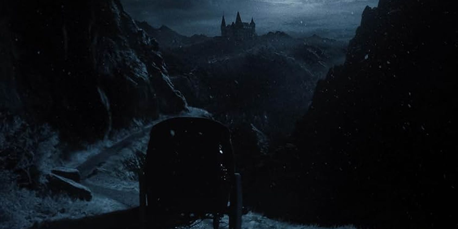 A dark horse-drawn carriage travels a narrow mountain path to a castle atop the Carpathian Mountains.