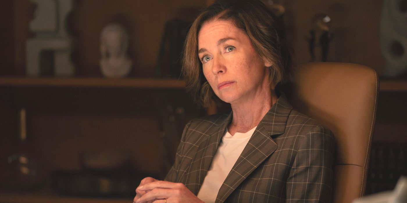 Samantha Redmond (Julian Nicholson) sits in a plaid blazer in Horu's TV show Paradise