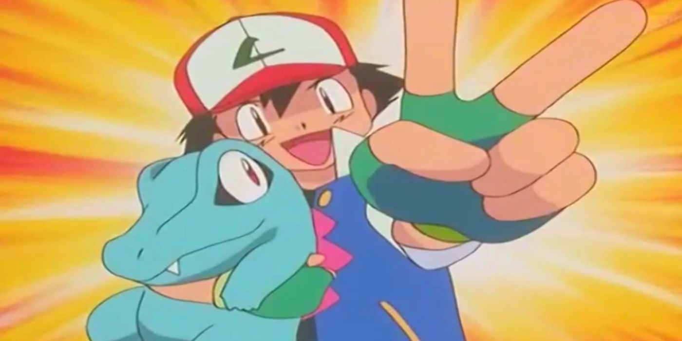 Ash abraçando e comemorando com seu Totodile em Pokemon: The Johto Journeys.