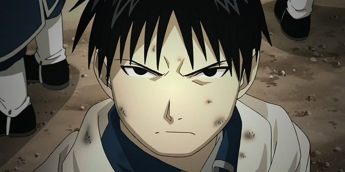 Roy Mustang scowls as he looks up in his uniform.