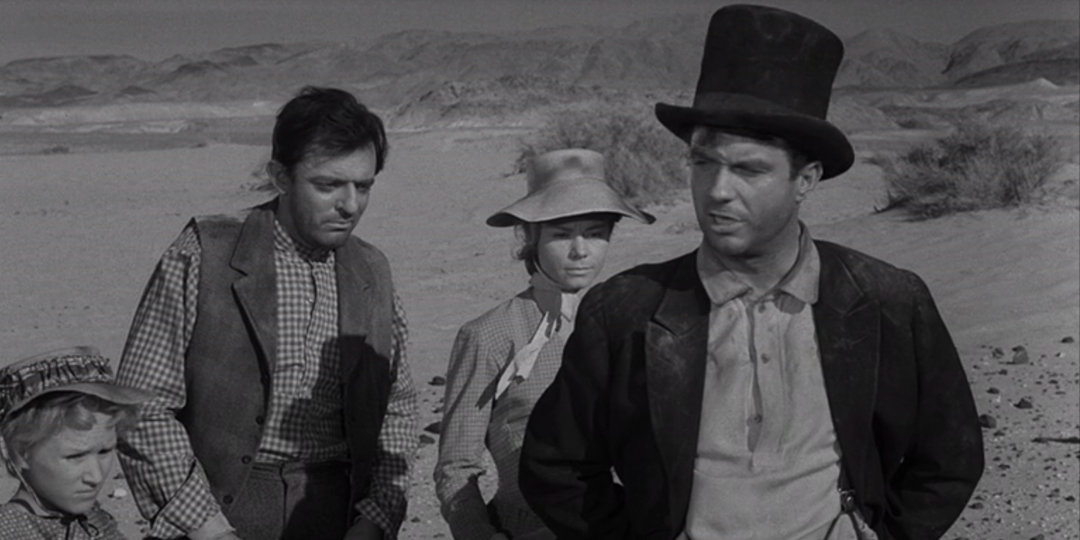 The Twilight Zone - A group of settlers (played by Cliff Robertson and John Astin) in "A Hundred Yards over the Rim" 