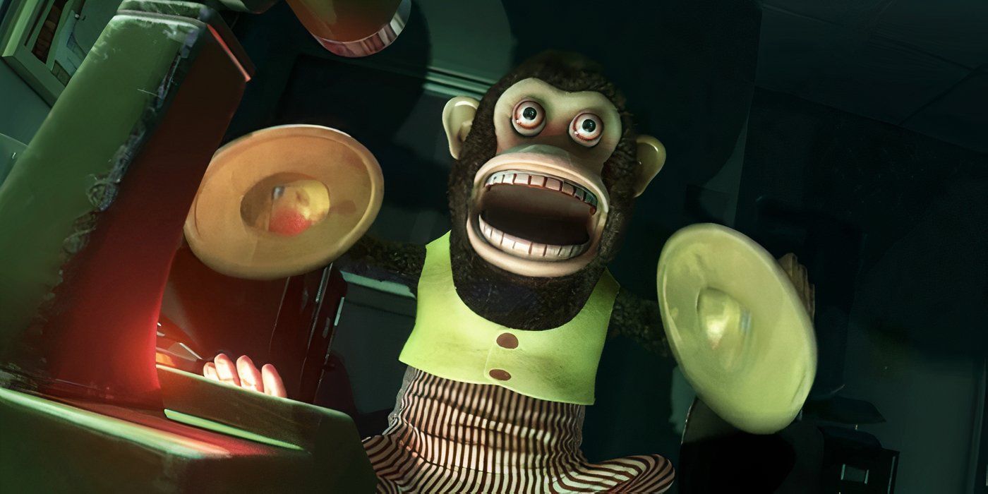 O macaco bate em seus pratos para alertar os outros brinquedos em Toy Story 3