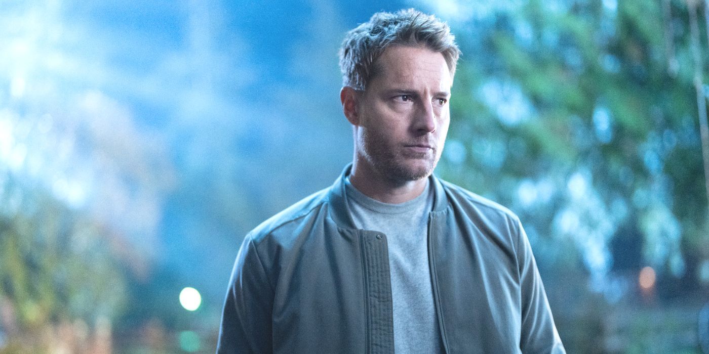 Colter Shaw (Justin Hartley) vestindo uma jaqueta cinza, de pé na floresta na CBS Show Tracker