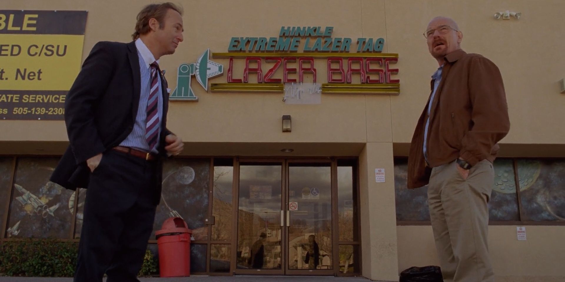 Walt and Saul stand outside The Lazer Base in Breaking Bad