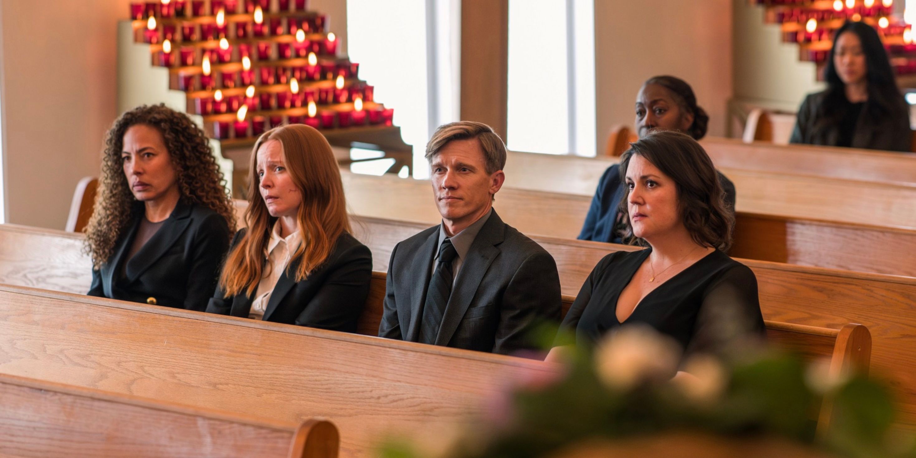 Taissa (Tawny Cypress), Van (Lauren Ambrose), Jeff (Warren Kole) and Shauna (Melanie Lynskey) at a funeral on Yellowjackets