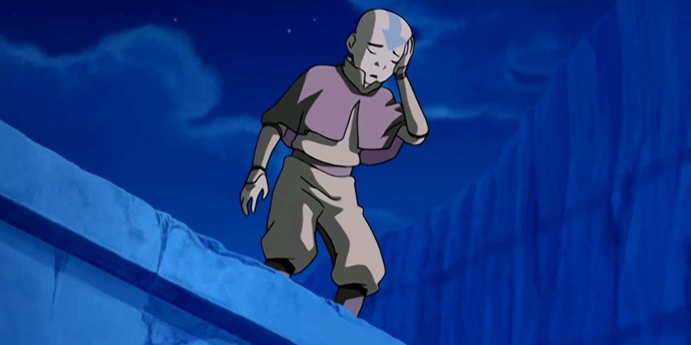Aang sostiene su cabeza mientras está de pie en una pared de hielo.