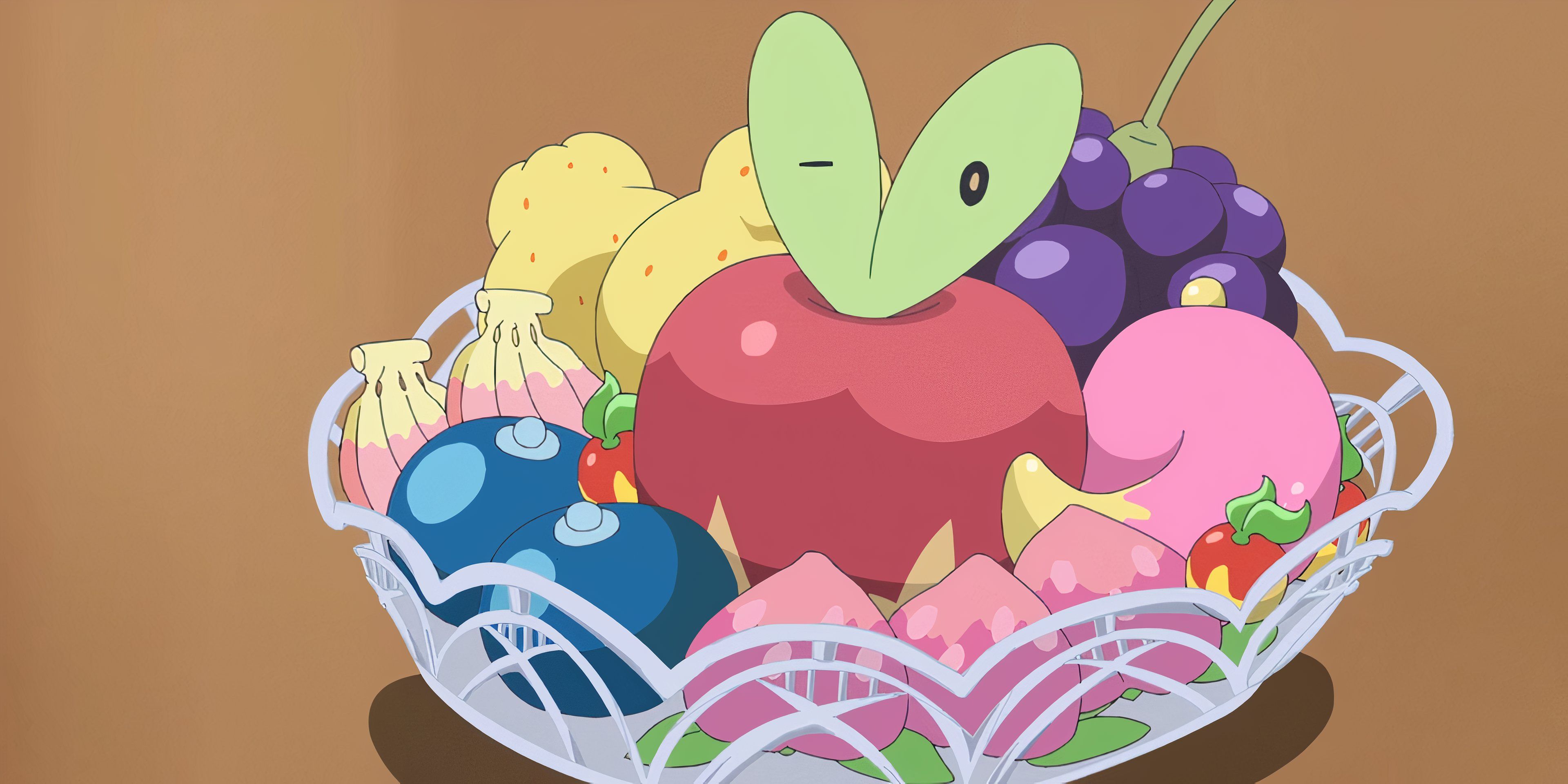 Aplica sentado em uma tigela de frutas em horizontes de Pokémon.