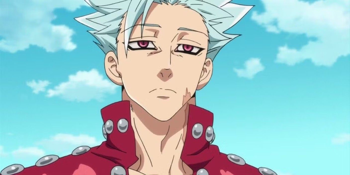 Ban makes a neutral face against a blue sky.