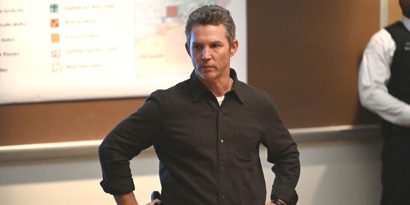 Chief Reid (Shawn Hatosy) wearing a dark shirt and standing with hands on hips in Chicago PD