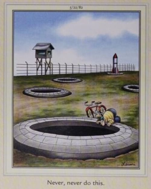 A child leans over a missile silo