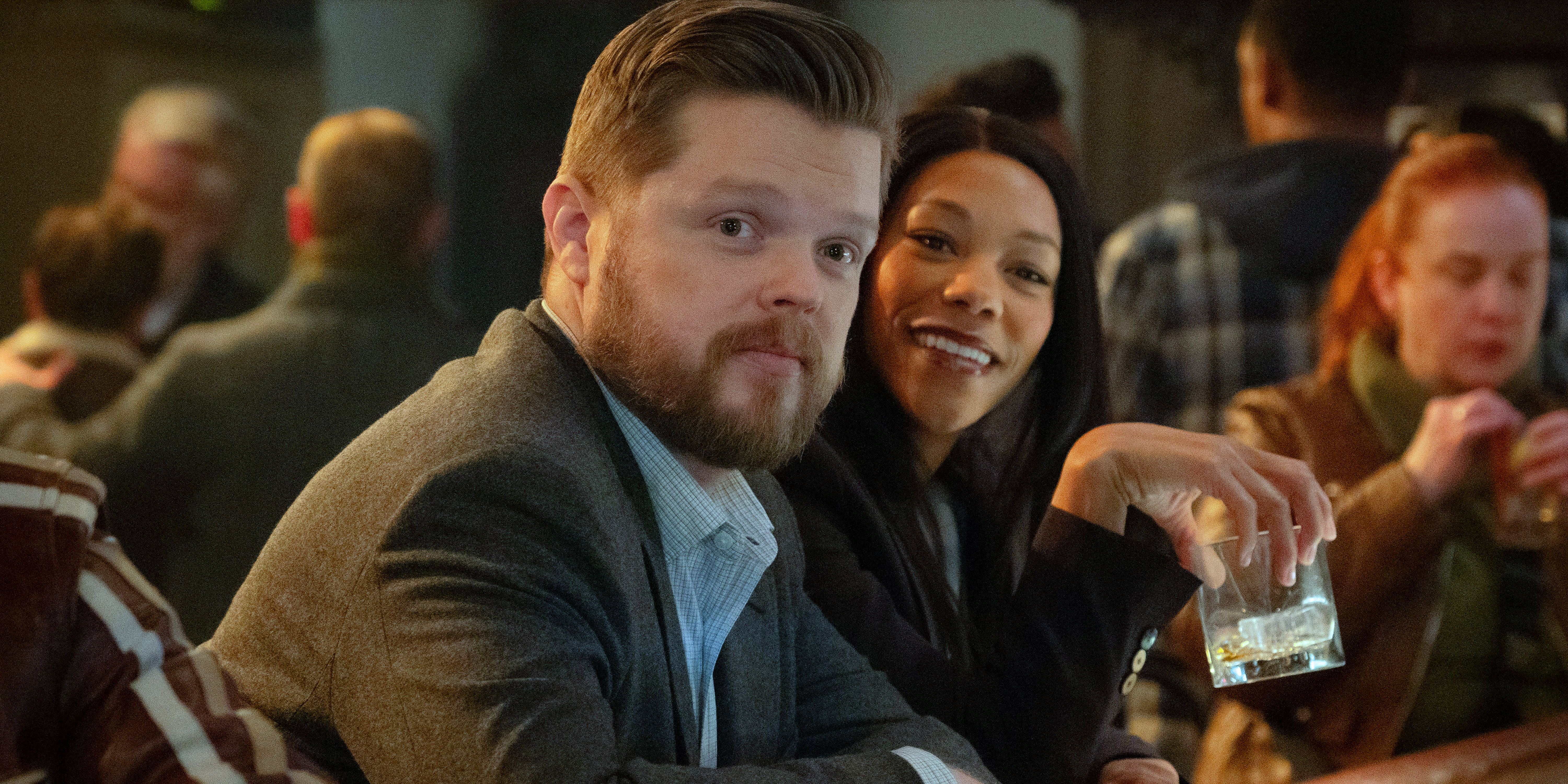 Foggy Nelson in a suit next to Kirsten McDuffie in black at a bar from Daredevil: Born Again