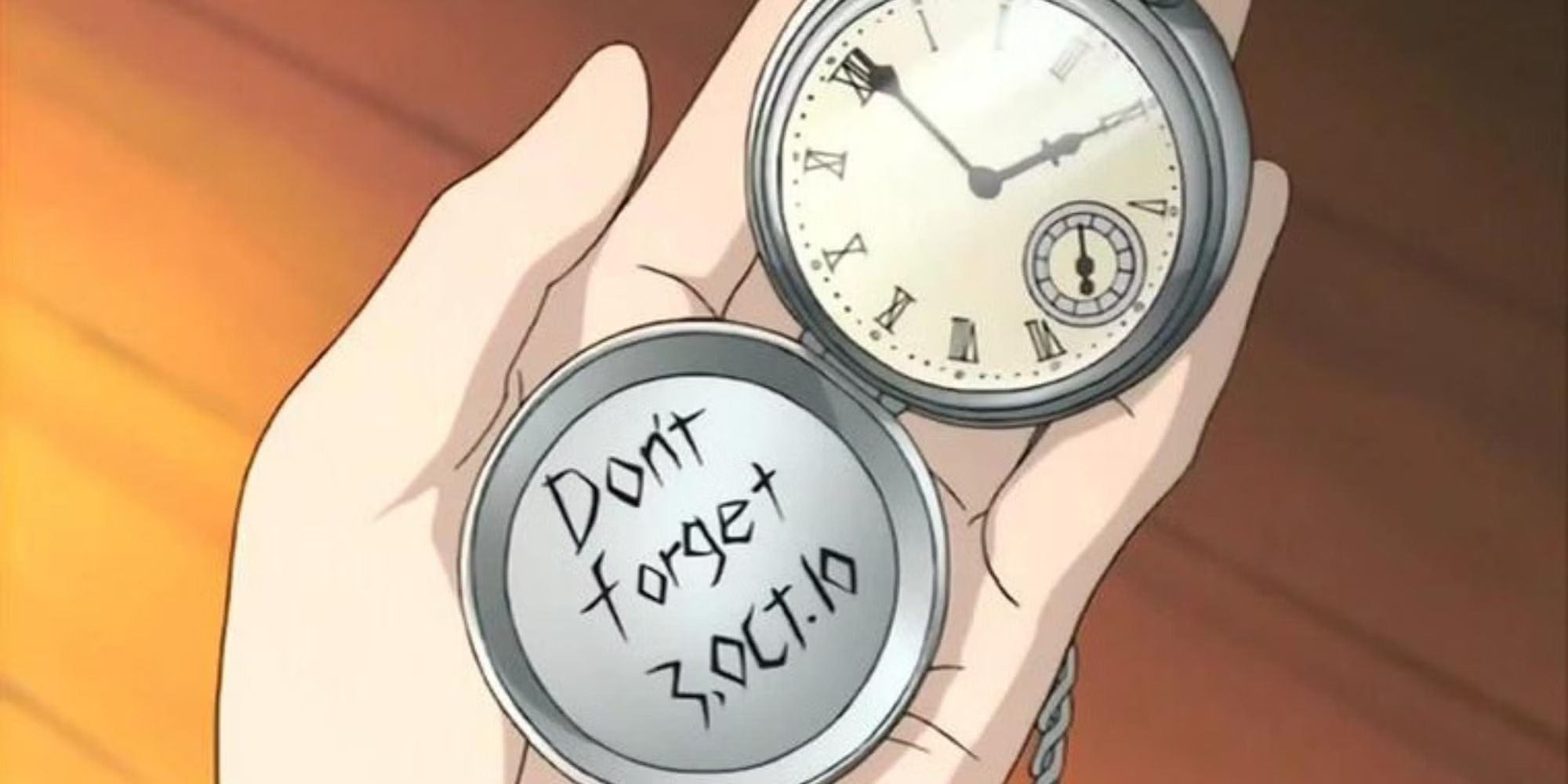 Um Pocketwatch de prata com uma data inscrita: 3 de outubro 10 e as palavras "Não se esqueça" 