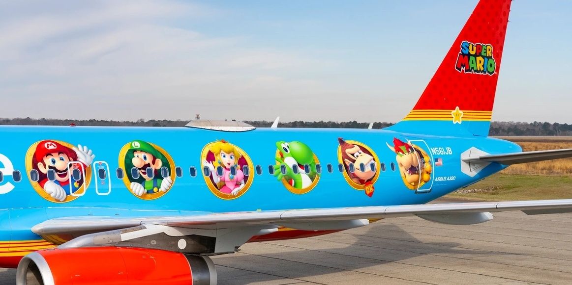 The side of the Mario-themed JetBlue plane on the runway