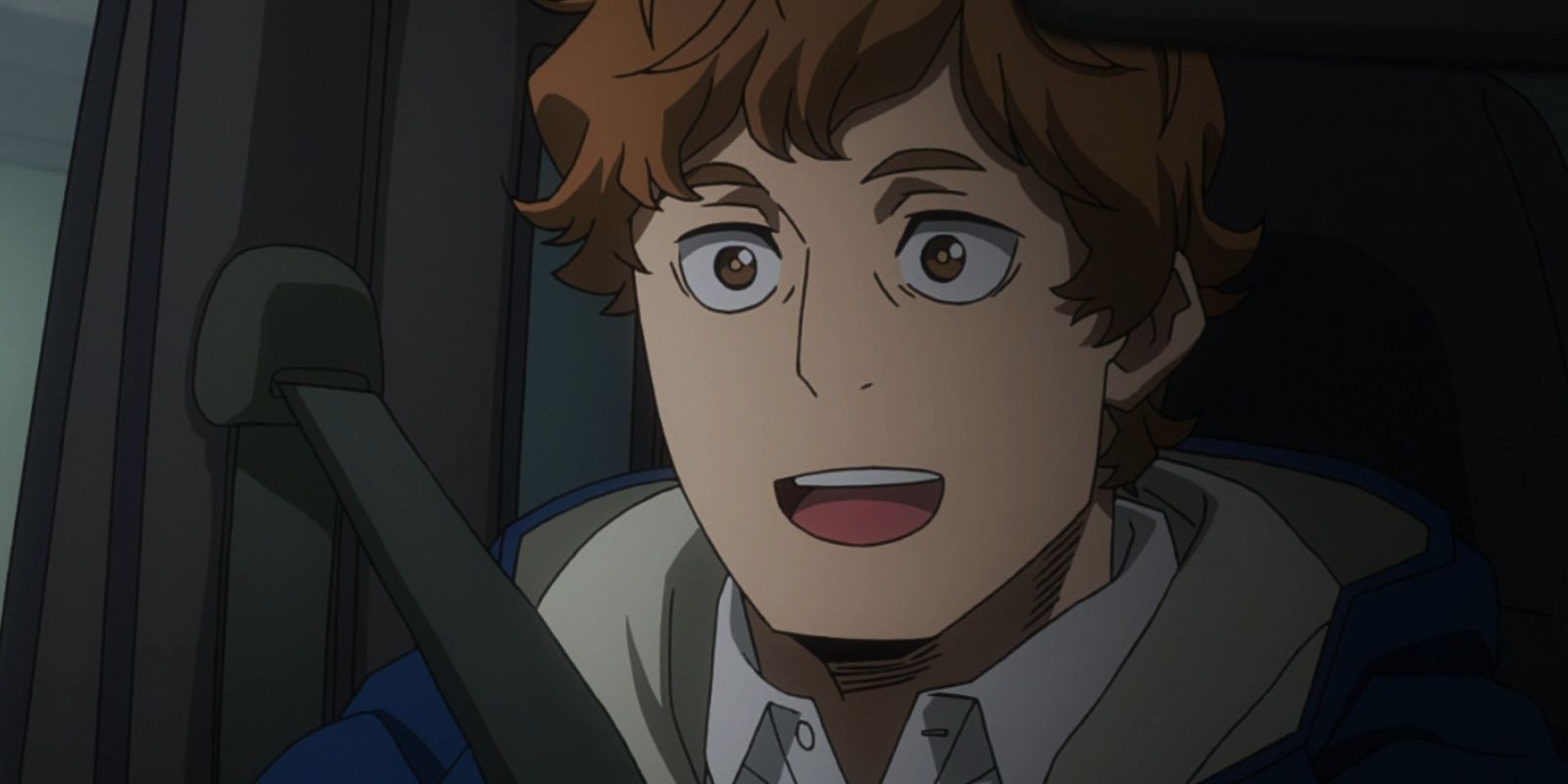 Katsuma's father in a truck as he smiles happily.