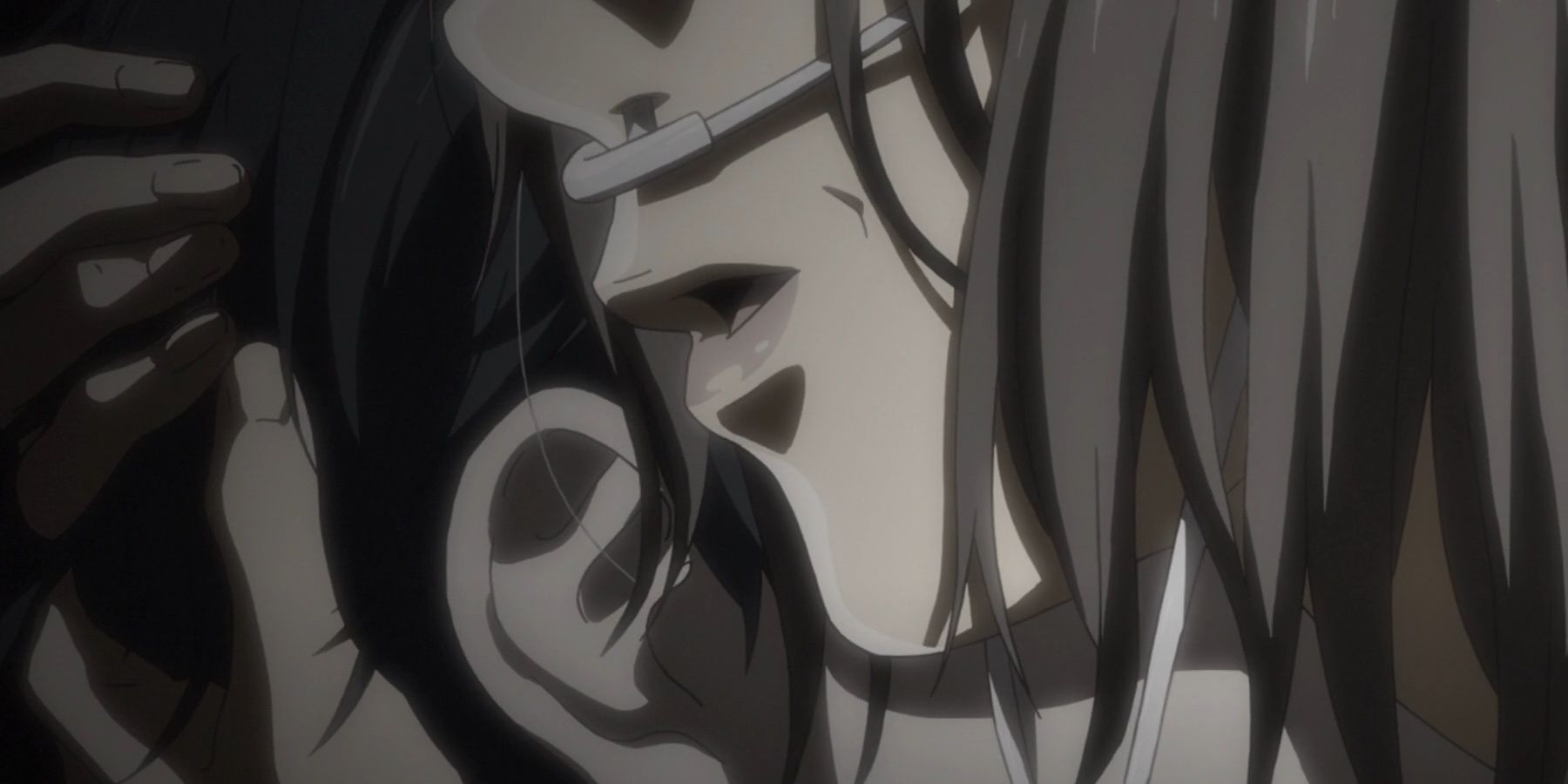 Kousei Arima's mother whispers into his ear.