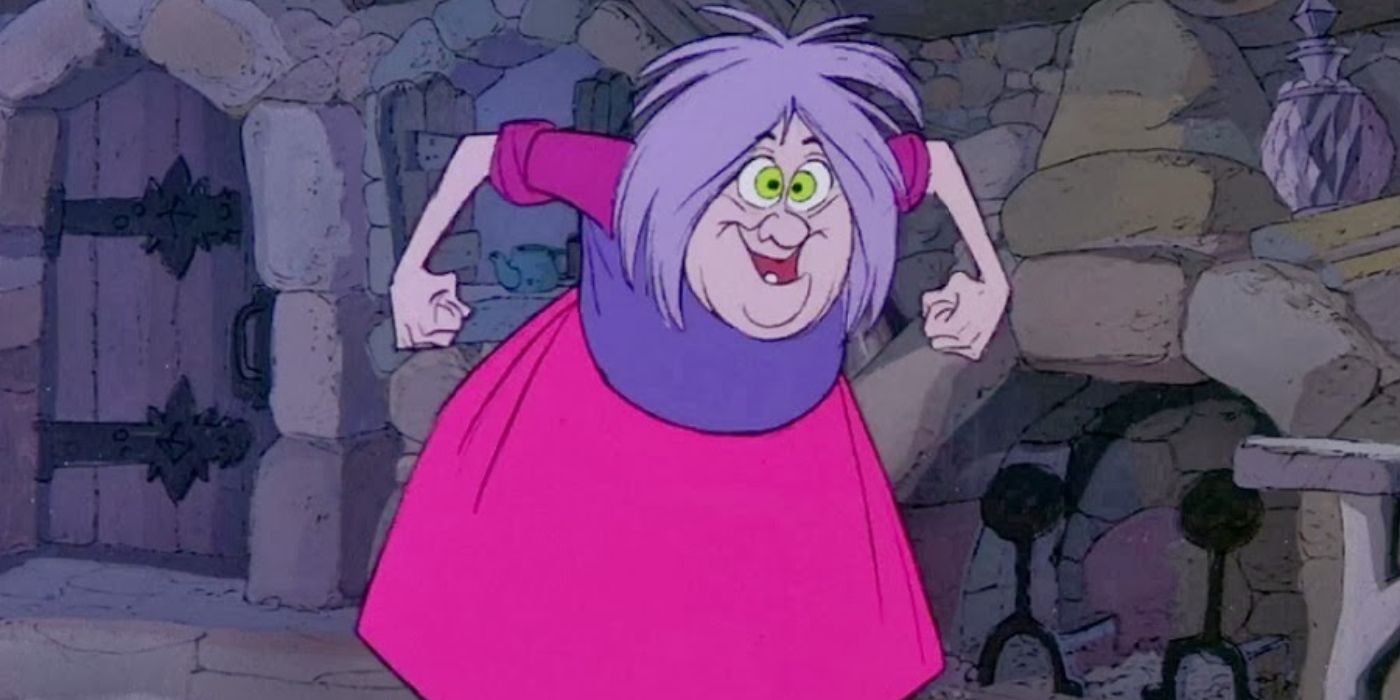 Madam Mim stands in front of a fireplace in The Sword in the Stone