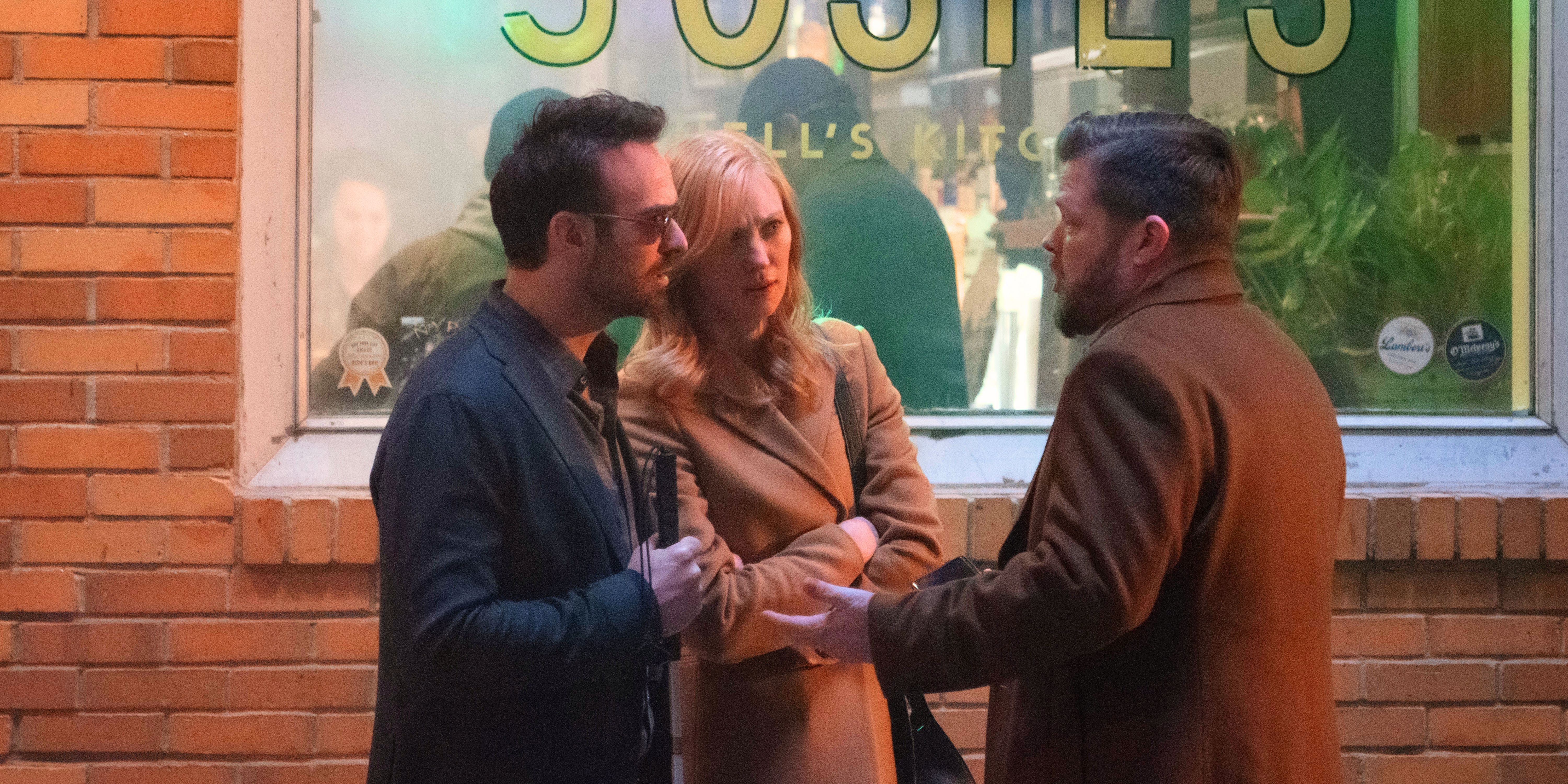 Matt Murdock and Karen Page facing Foggy Nelson in front of Josie's bar in overcoats from Daredevil Born Again.