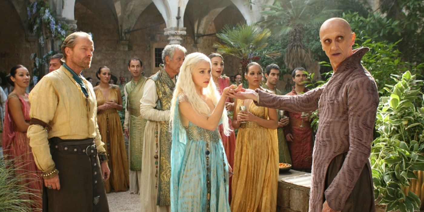 Pyat Pree holds Daenerys' hand as Jorah and others look on in Game of Thrones.