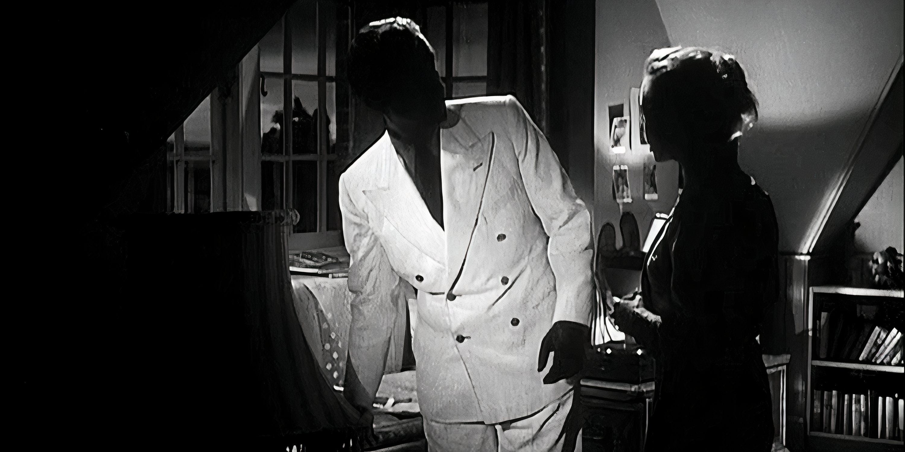 Two silhouetted figures talk next to a piano in The Man in the White Suit