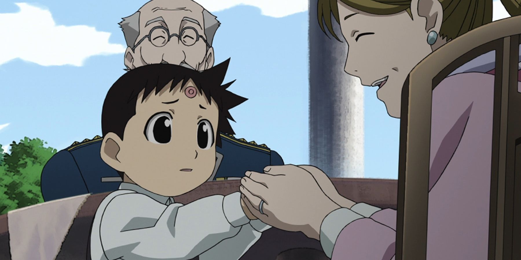 Selim Bradley parece preocupado quando sua mãe segura as mãos ao ar livre.