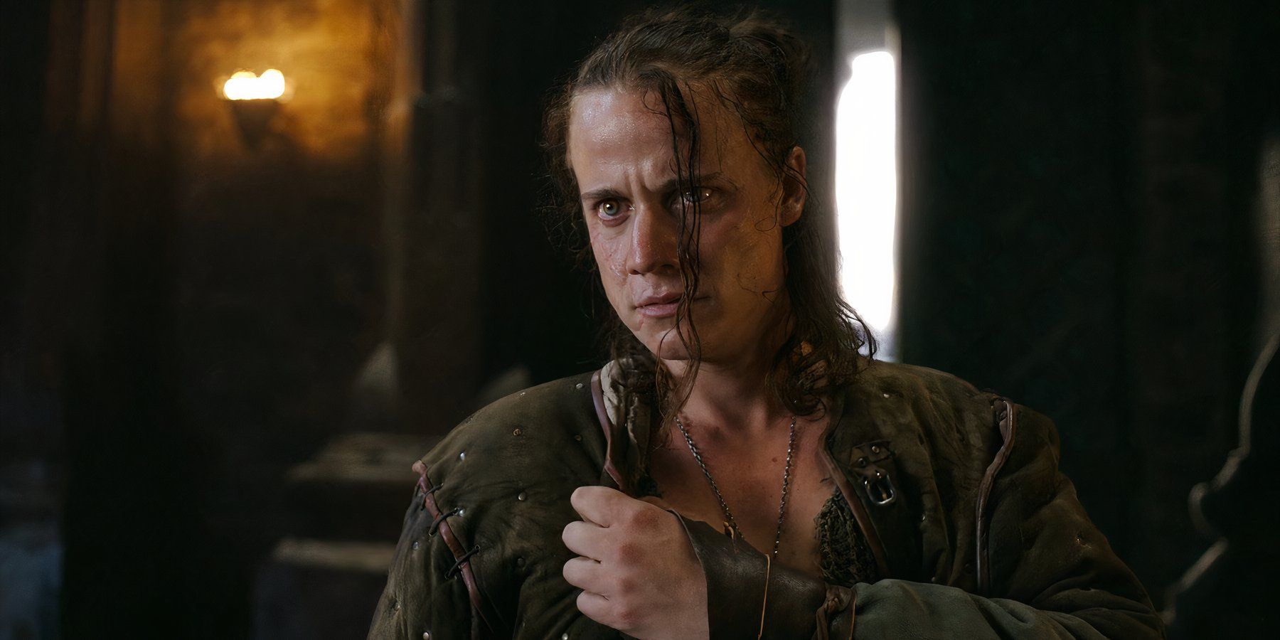 A close-up of Eskel pressing his arm over his chest