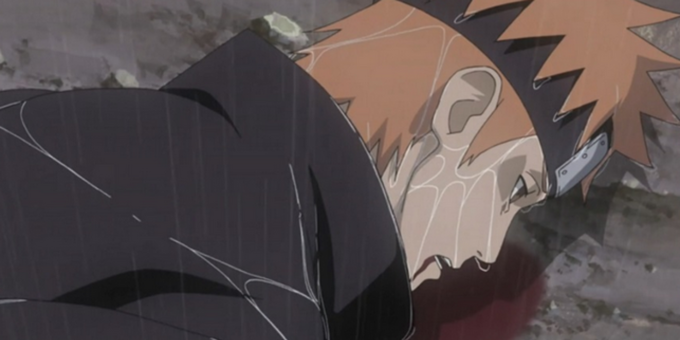 Yahiko has blood dripping from his mouth and pooling under him as he lies on the ground, dying, in Naruto: Shippuden.