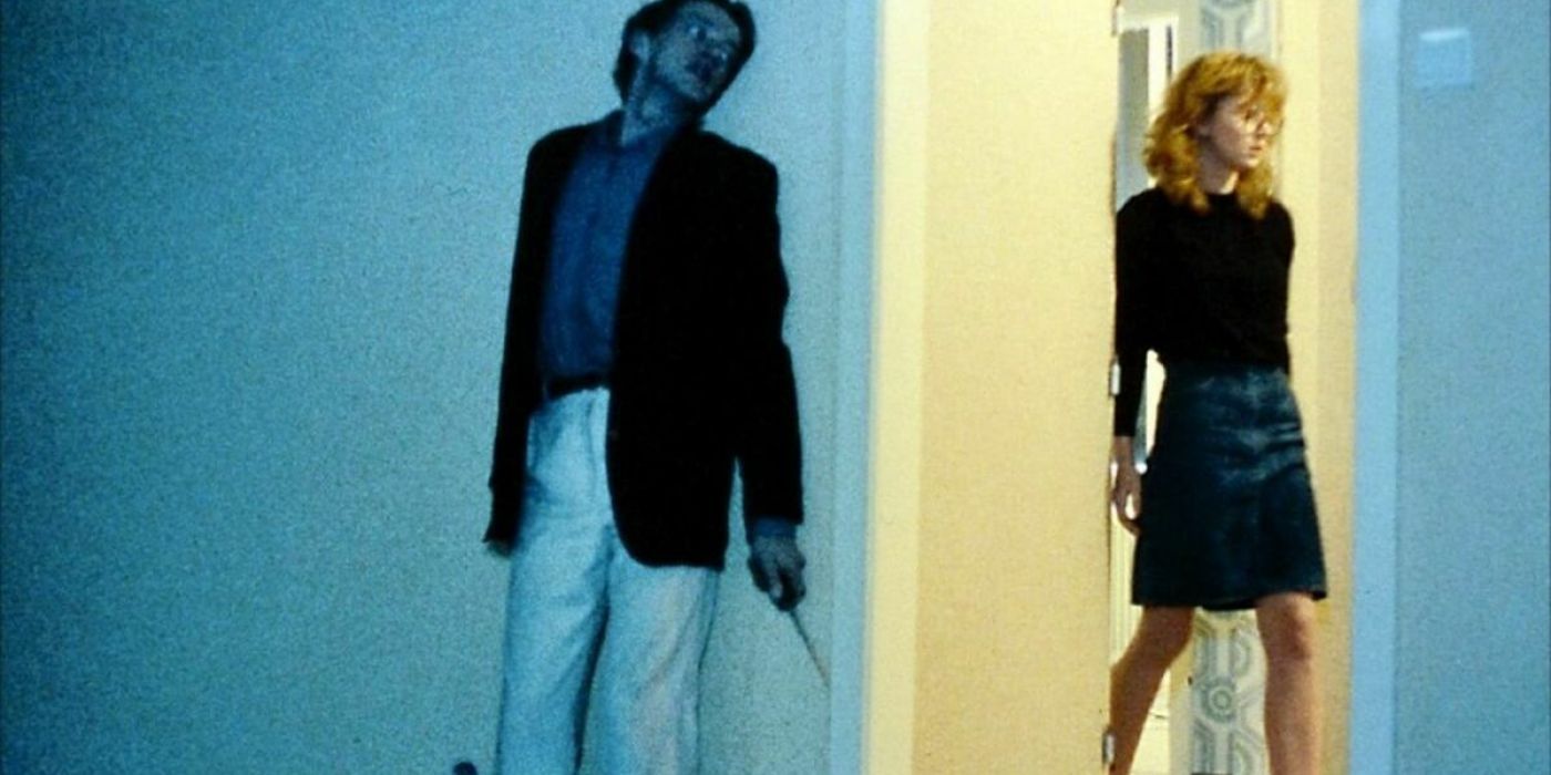 A man holds a knife and hides from a woman in Angst