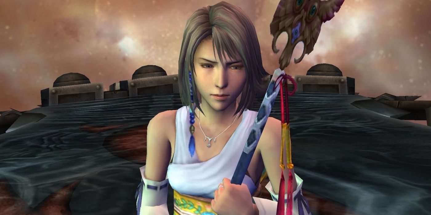 Yuna appears concerned while holding her staff in Final Fantasy X