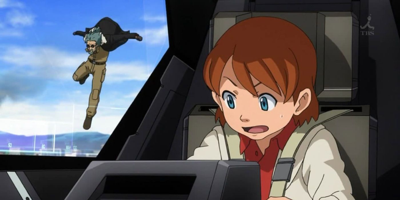 Kio Asuno, do Gundam Age, pilotando um Gundam enquanto seu avô pula do mecanismo atrás dele.