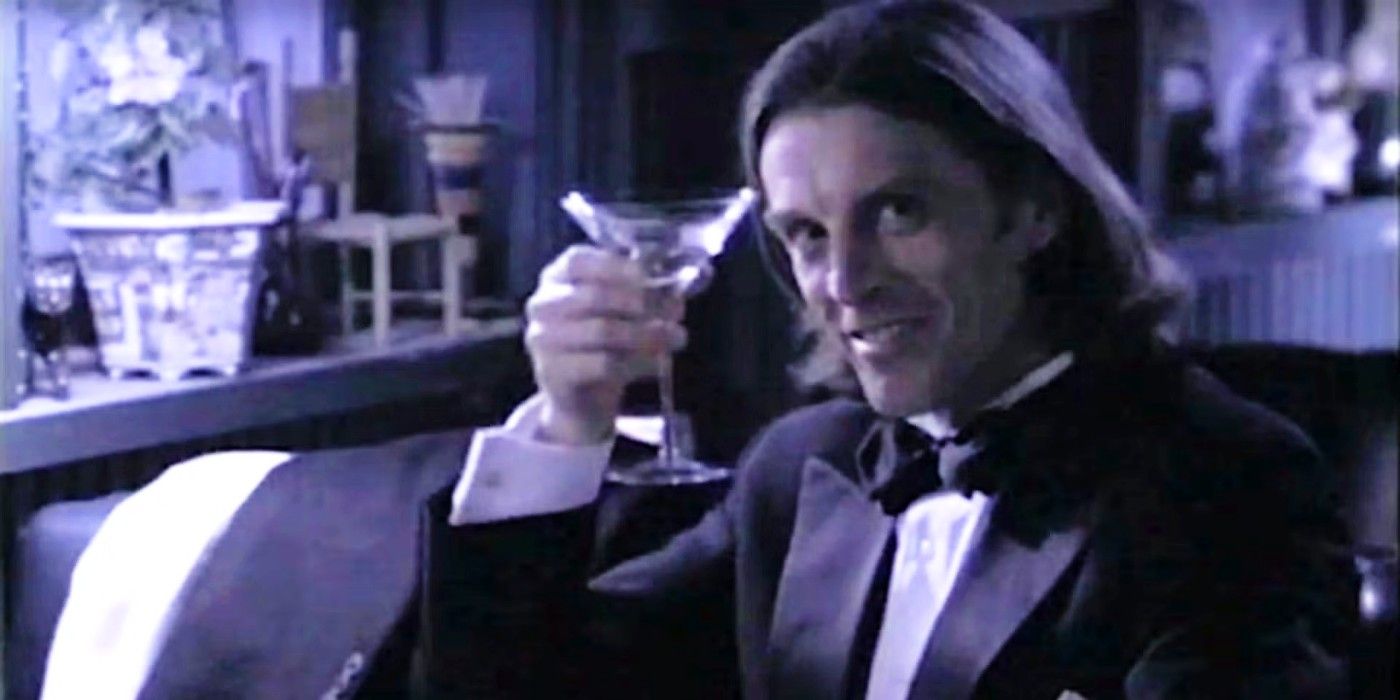 John Glover as The Devil holding a martini in Brimstone