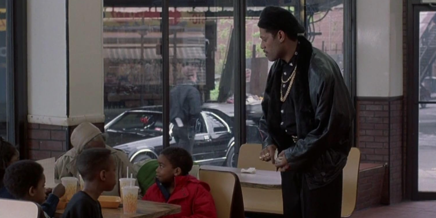 Laurence Fishburne gives children money in King of New York
