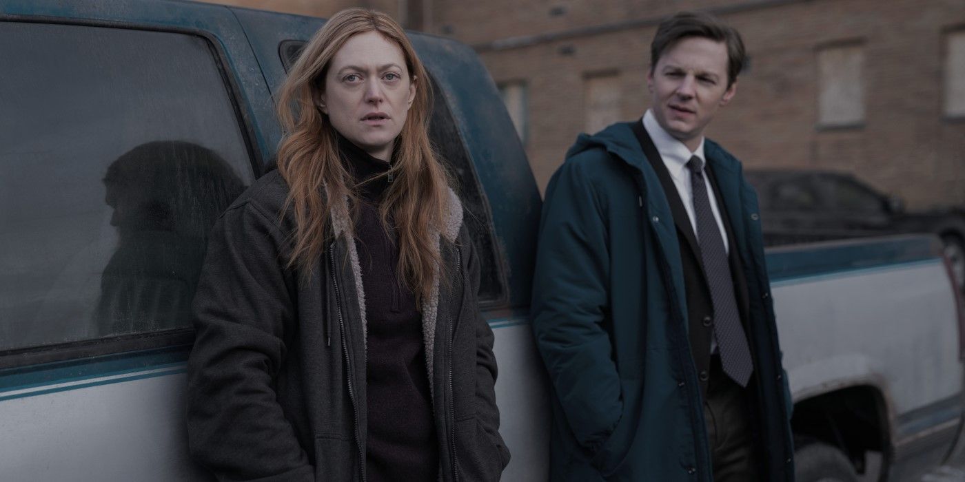 Mina and Marchetti, both carrying black coats, stand next to a truck in the television show Dope Thief