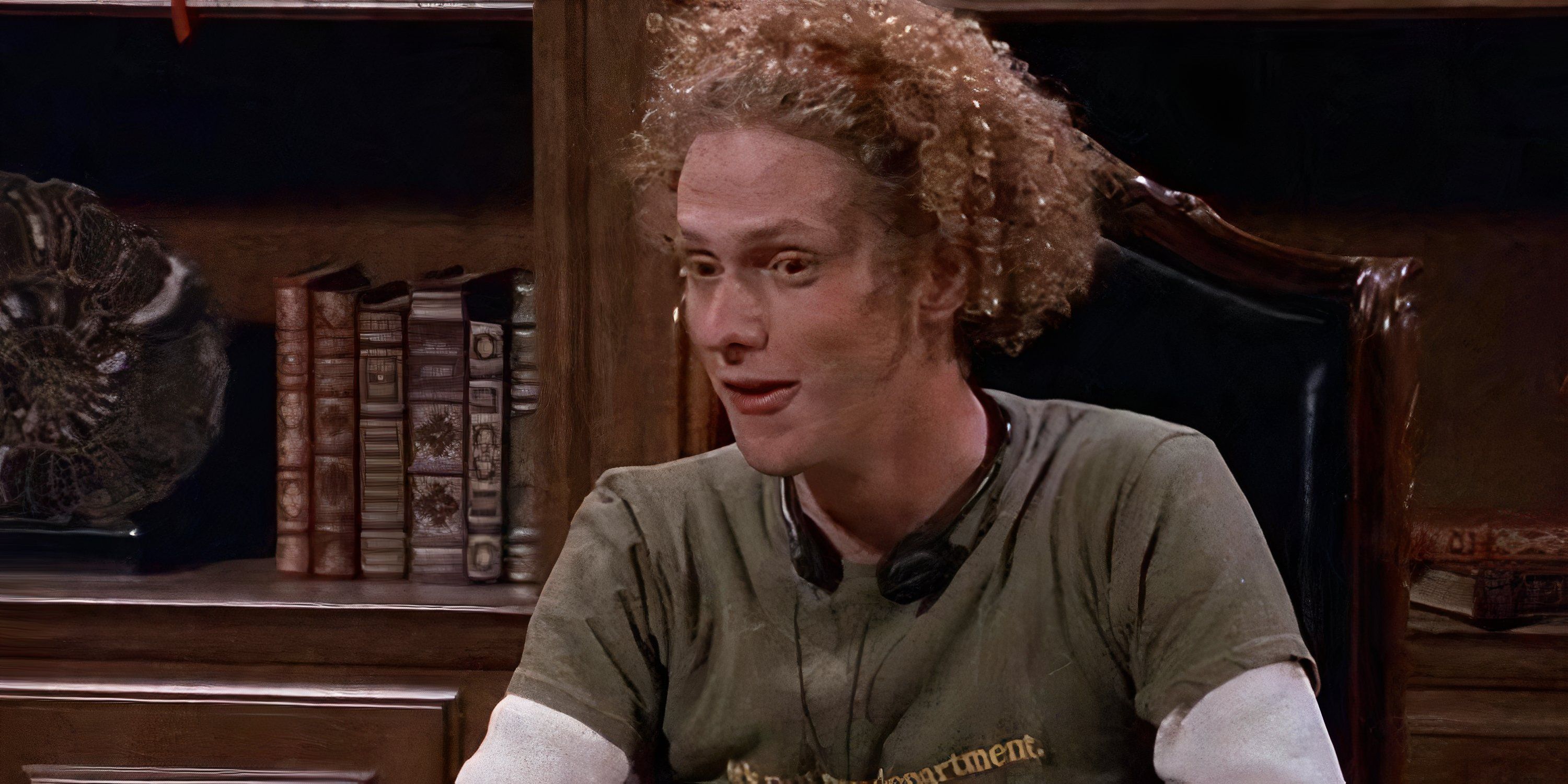 Kirby from Frasier laughs while sitting down