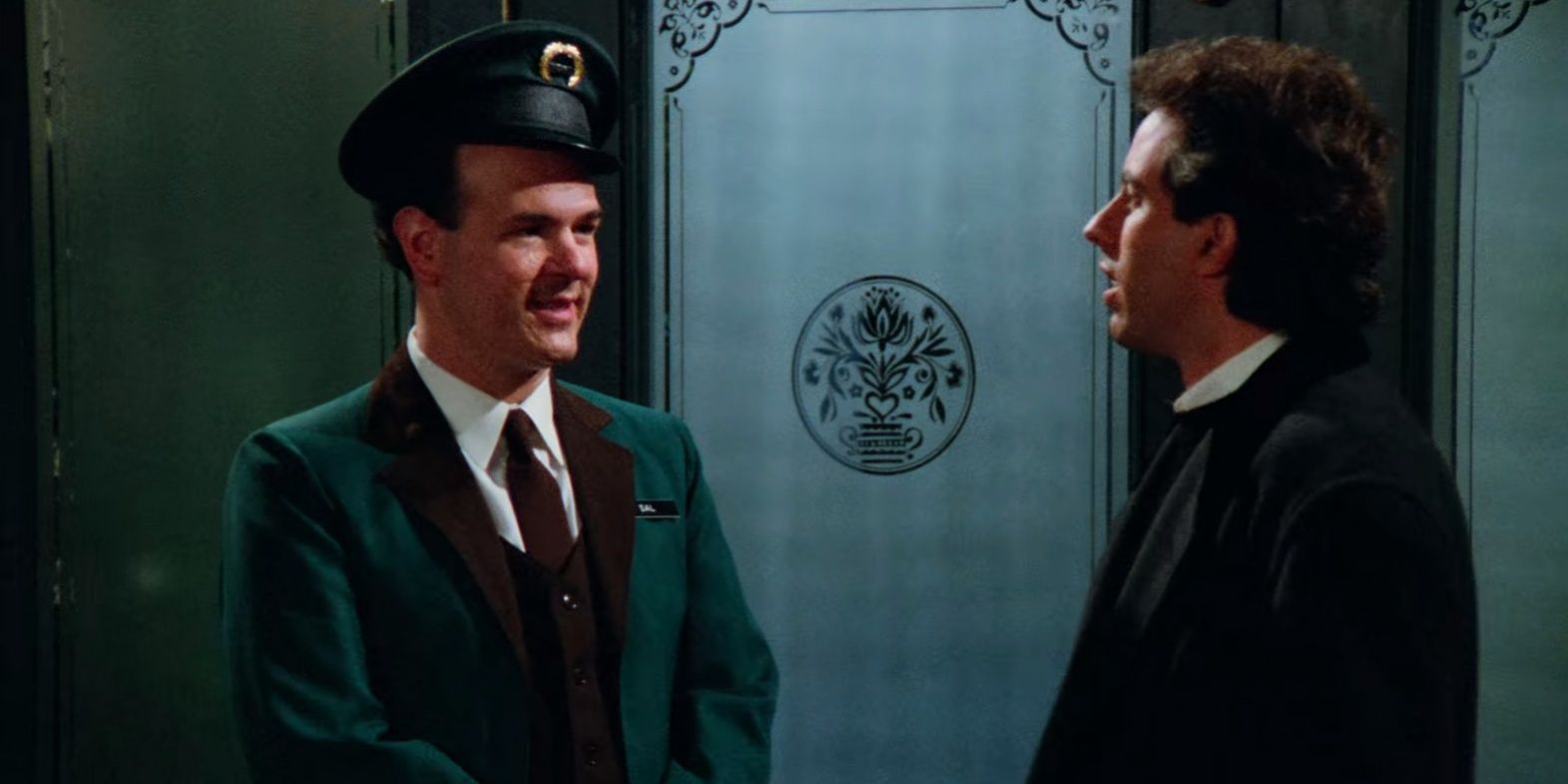 Larry Miller as The Doorman and Jerry Seinfeld as Jerry Seinfeld in Seinfeld