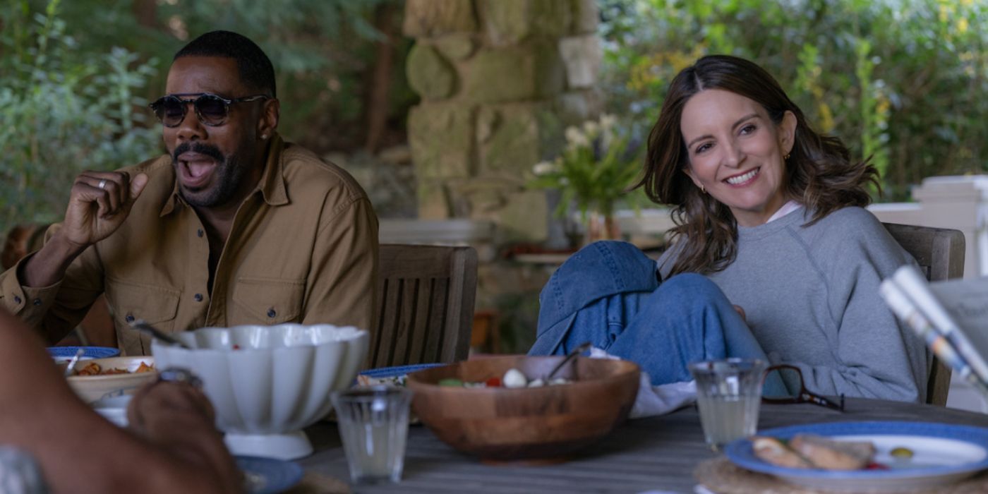 Danny and Kate laughing at the table outside in The Four Seasons