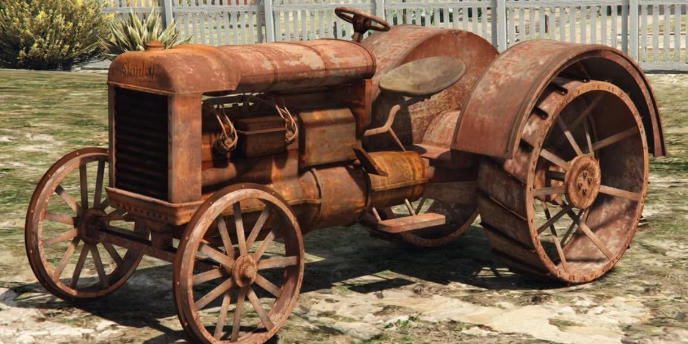 The rusty tractor of Grand Theft Auto V is parked on a lawn near a white fence.