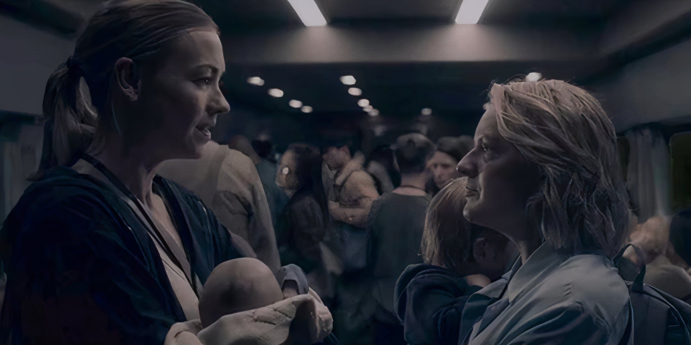 June and Serena stand facing each other in a crowded train