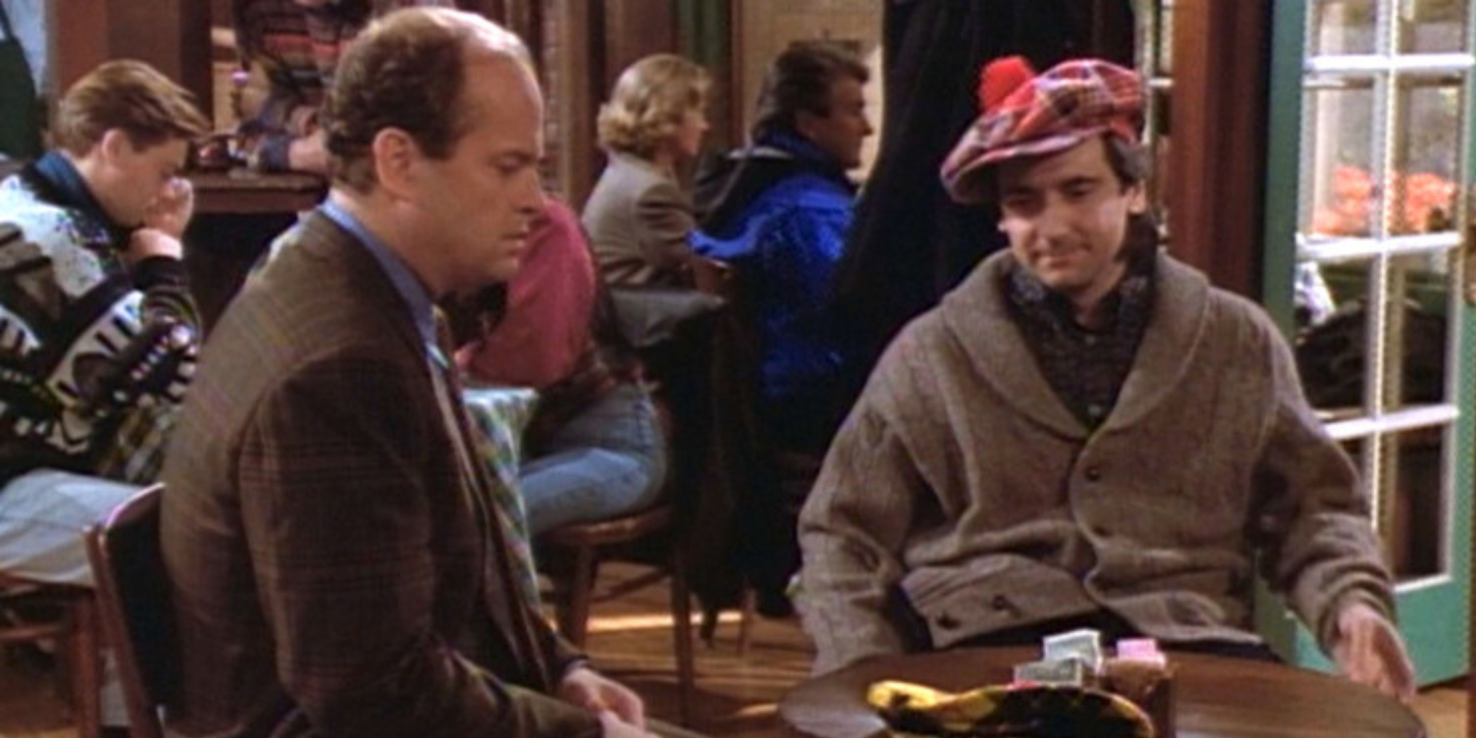 Bob and Frasier sitting at a table in Cafe Nervosa