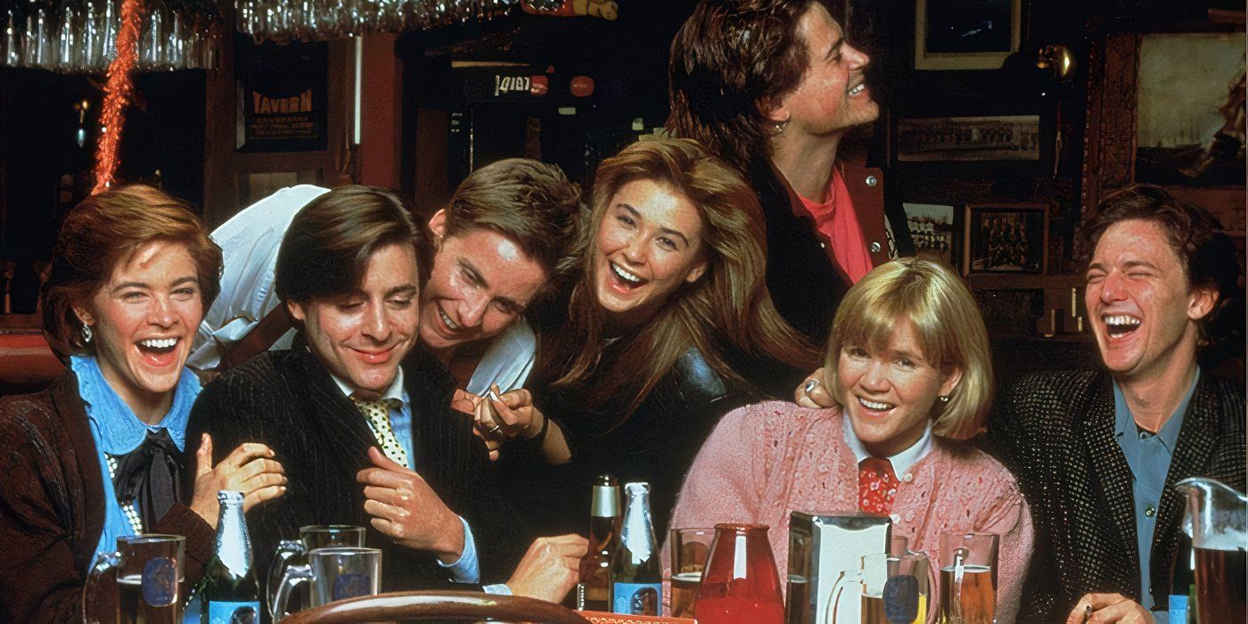The college students are sitting at a table and laughing in St. Elmo's Fire