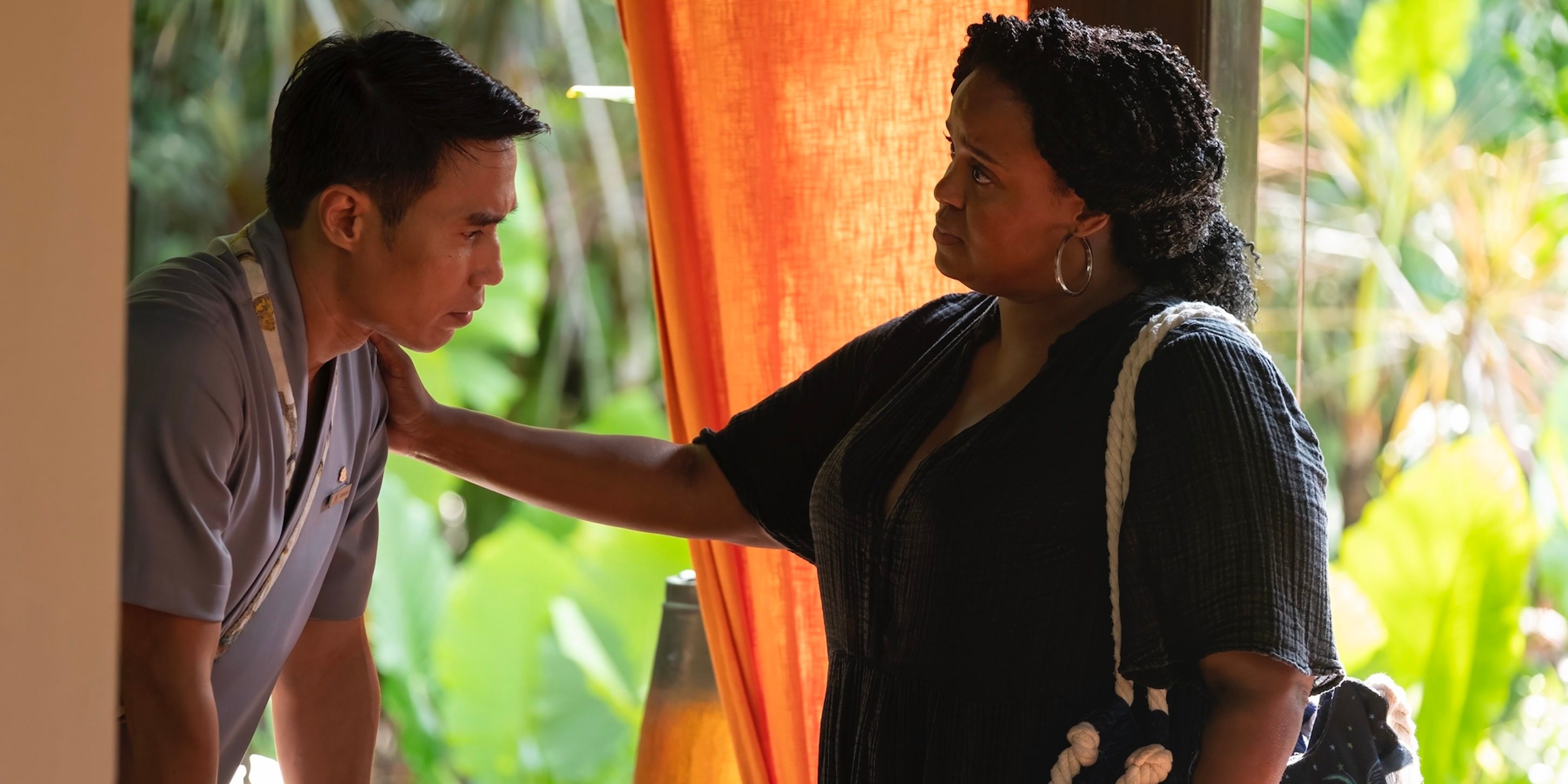 Belinda wearing a black shirt, with his hand on Pornchai's shoulder in season 3 of the white lotus