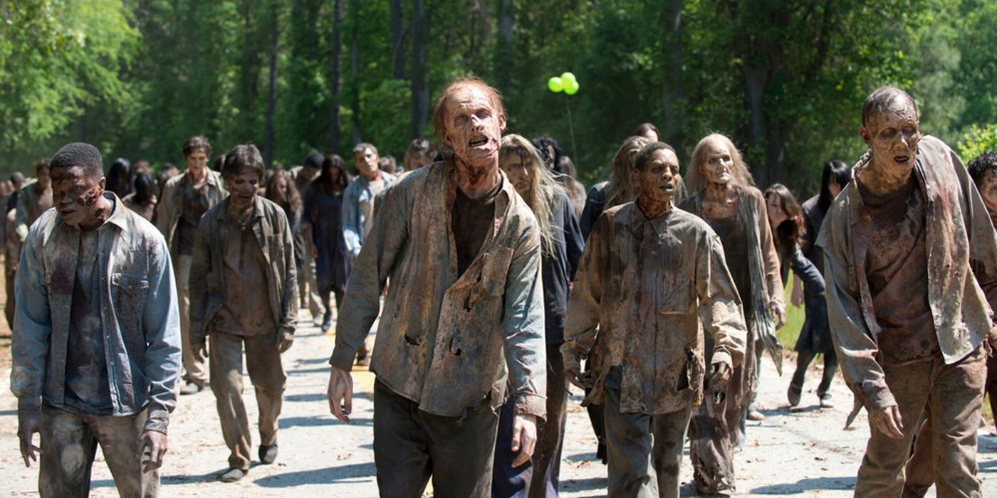 A horde of zombies walking towards the camera in The Walking Dead.