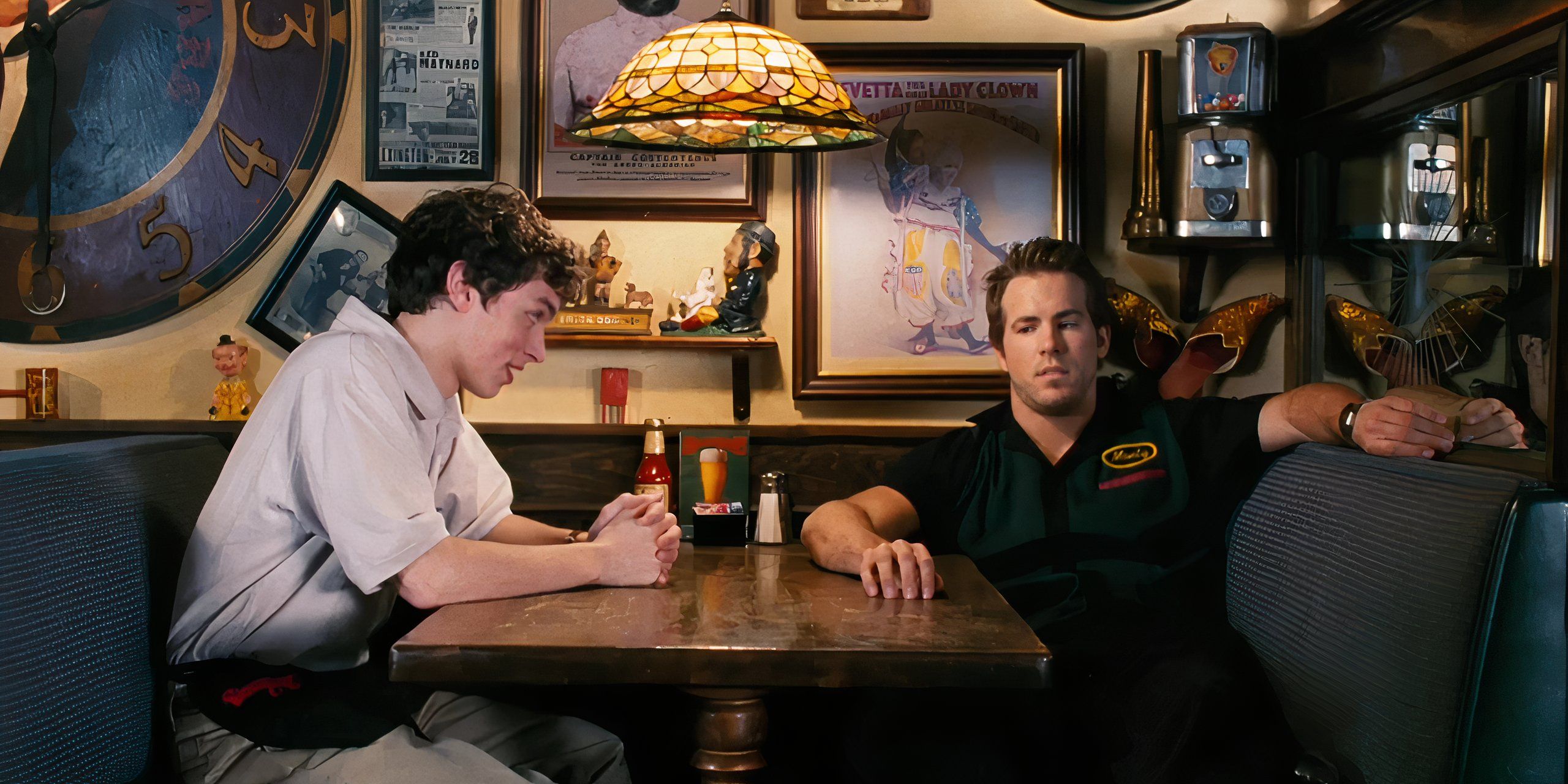 Mitch and Monty are sitting together at a booth in ShenaniganZ in Waiting...