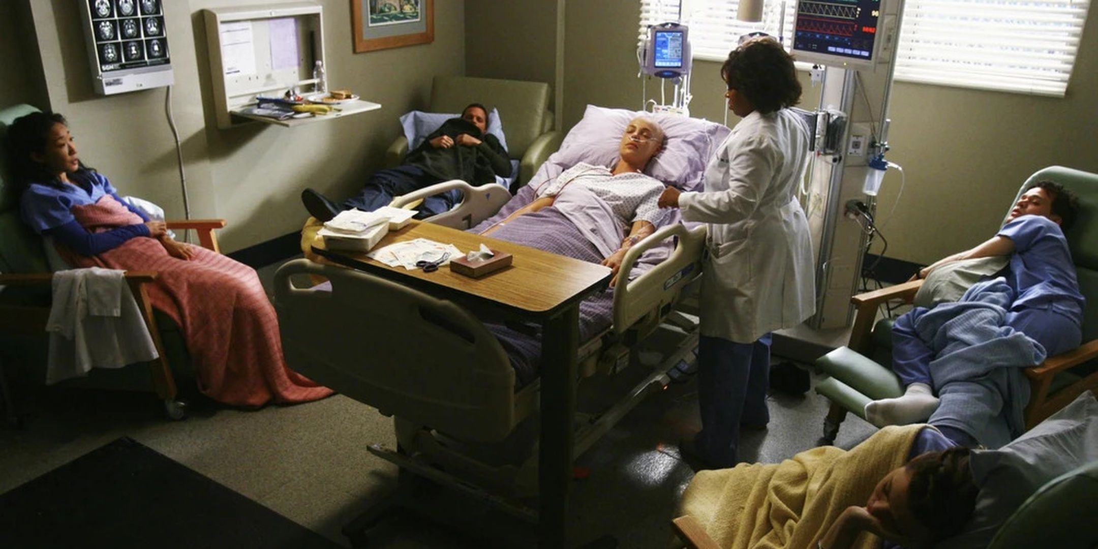 The interns and Bailey gather around Izzie's bed in Grey's Anatomy