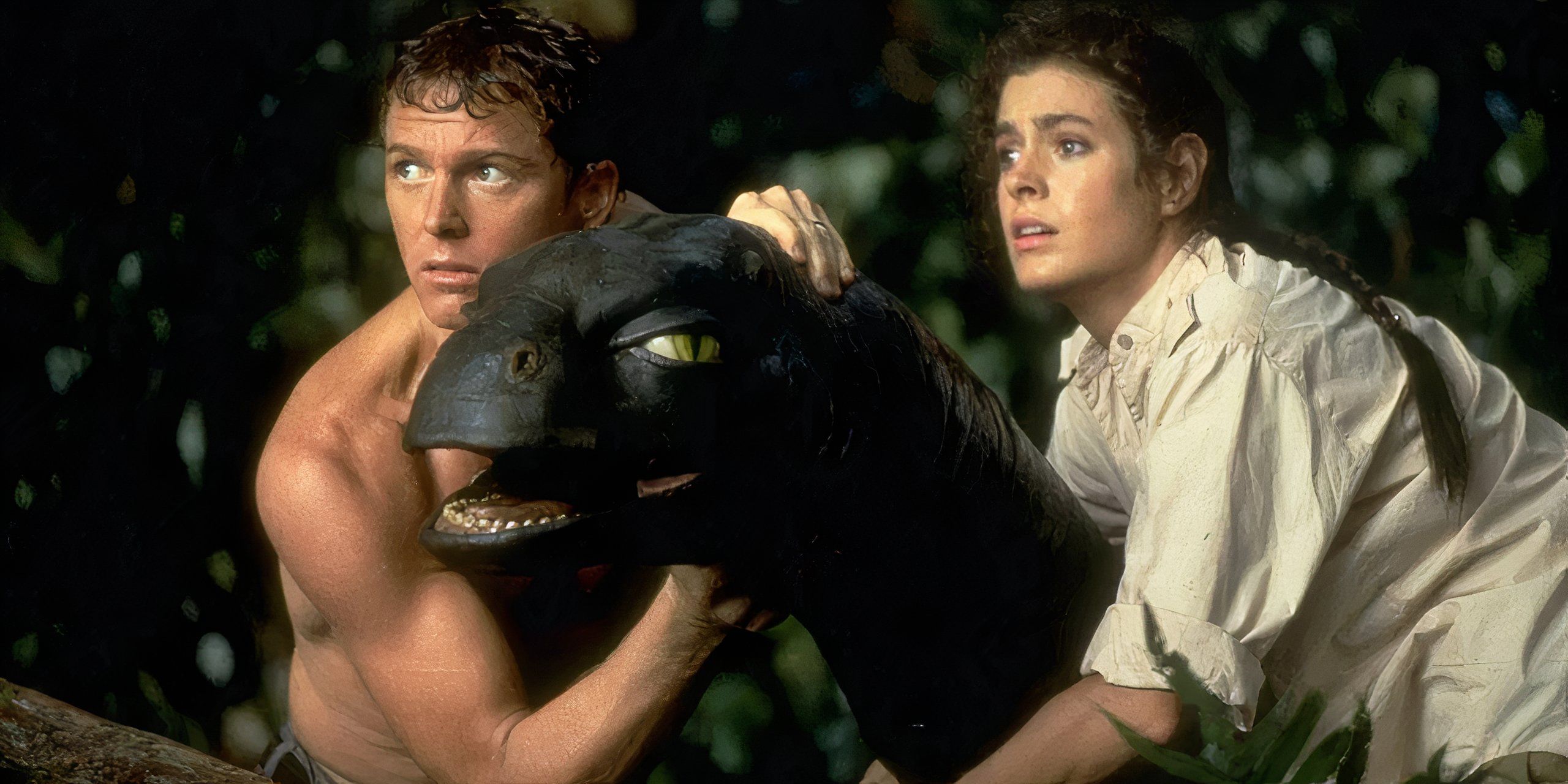 William Katt y Sean Young con un dinosaurio bebé en Baby Secret of the Lost Legend
