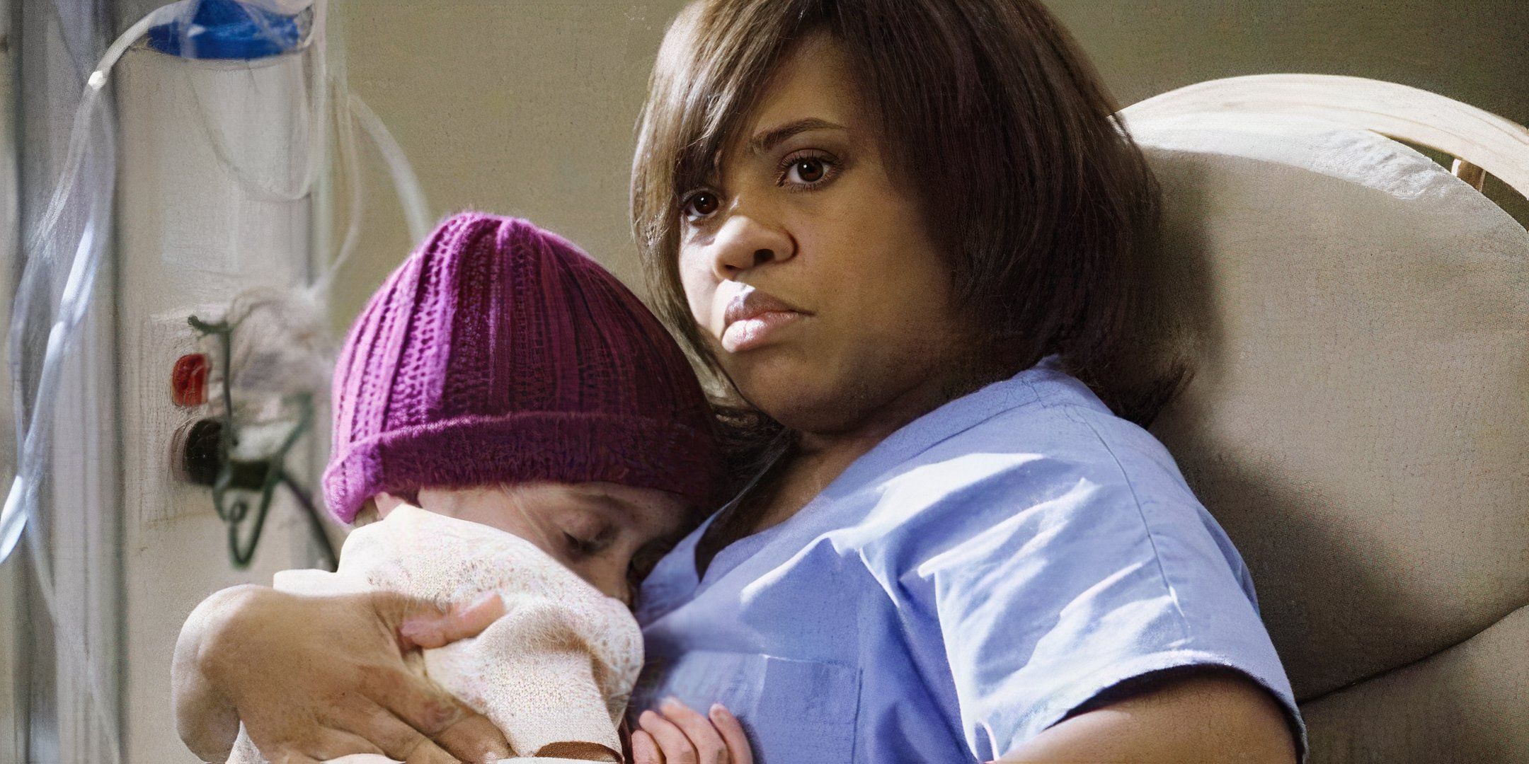 Dr. Bailey looking up while holding a sleeping Jessica Smithson in Grey's Anatomy